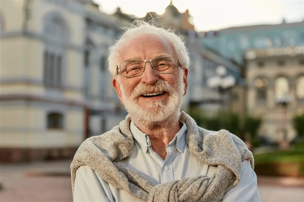 Senior patient smiling with natural-looking dental implants