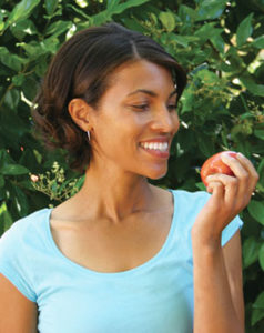 Woman eating an apple